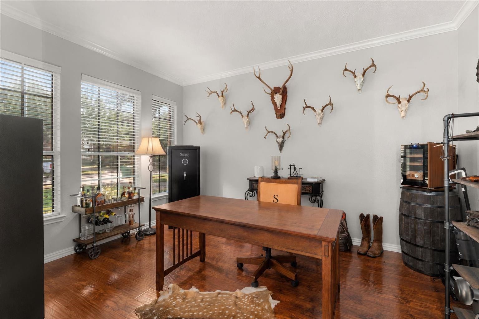 2437 La Rochelle Court, Seabrook, TX 77586 Dedicated study features crown molding, wood flooring, and multiple windows for natural light.