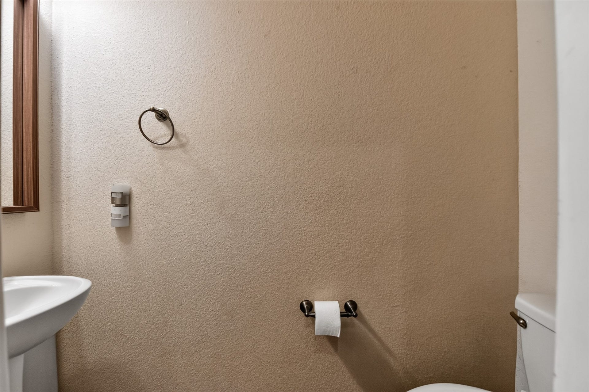 Indoor half bath downstairs for guest or quick access.