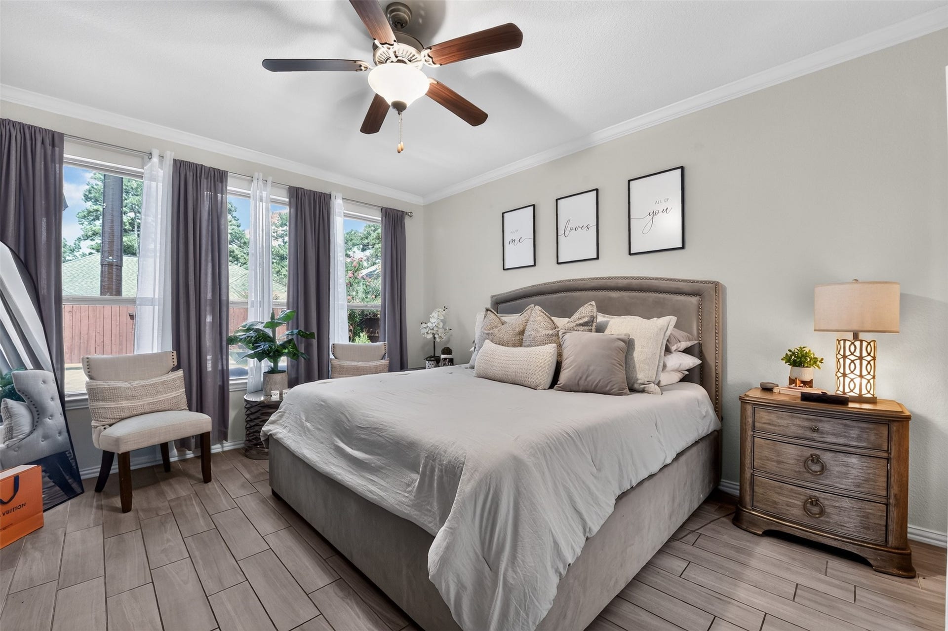 Large primary bedroom with huge windows