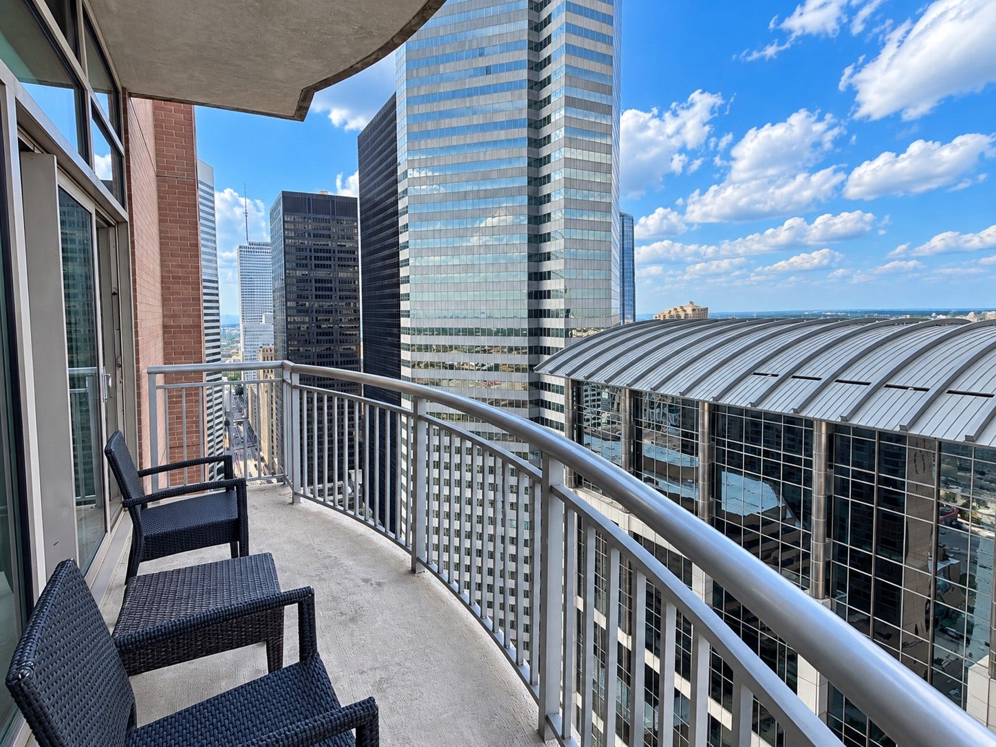 1400 McKinney Street, #1003, Houston, TX 77010 Your own private escape above the city. I love the idea of slow mornings out here, a glass of wine after work or simply sitting outside and watching Houston light up for the evening. *Photo taken from a similar residence on the 35th floor; views may vary.