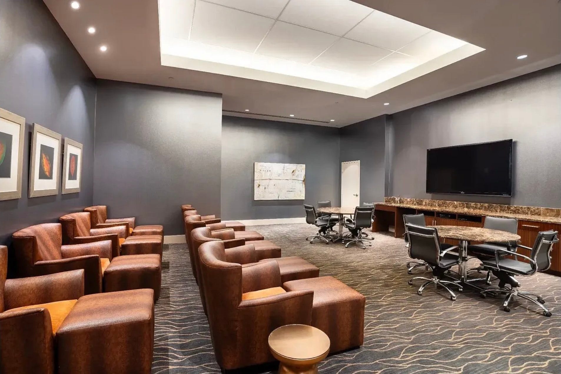 1400 McKinney Street, #1003, Houston, TX 77010 The thoughtfully designed resident media room offers plush lounge seating, a large-screen television, and versatile gathering spaces ideal for entertaining guests, hosting game days or enjoying a relaxing evening with neighbors and friends.