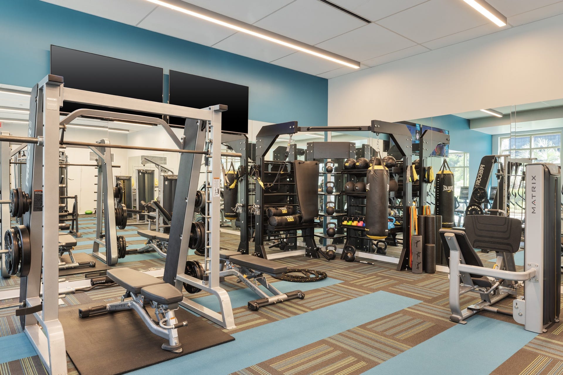 1400 McKinney Street, #1003, Houston, TX 77010 Designed for every fitness level, the dedicated strength-training area features squat racks, functional training stations, punching bags, resistance equipment, free weights and performance-focused workout zones providing everything needed for both strength and conditioning routines.