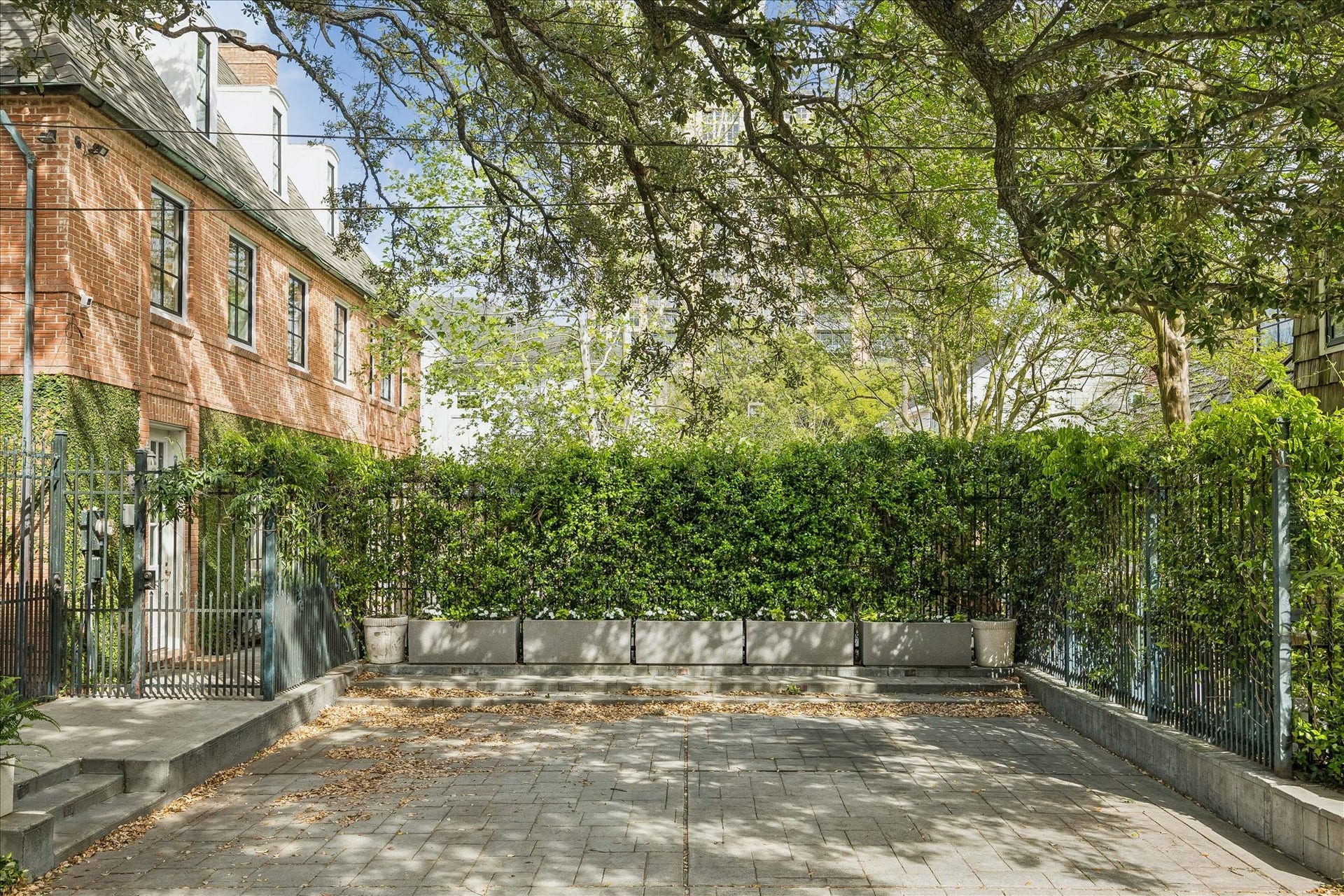 1117 Banks, Houston, TX 77006 Manicured gardens separate the main house and guest cottage.Recent roof and windows!Premier location in close proximity to Museums, Medical Center, Rice University, The Jung Center, Hermann Park and downtown. In addition to the 2-car garage there is a well-designed parking court.