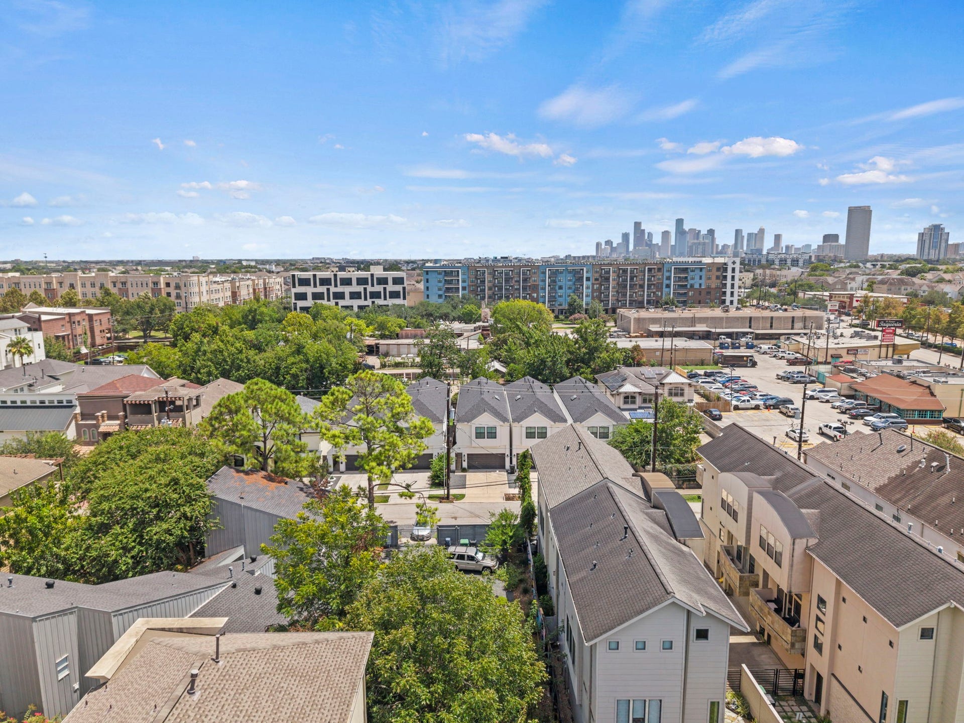 1128 Malone Street, Houston, TX 77007 The aerial view captures the homes Rice Military setting with nearby city views and surrounding inner-loop development. It gives context to the location near Washington Corridor, Memorial Park, and central Houston destinations.