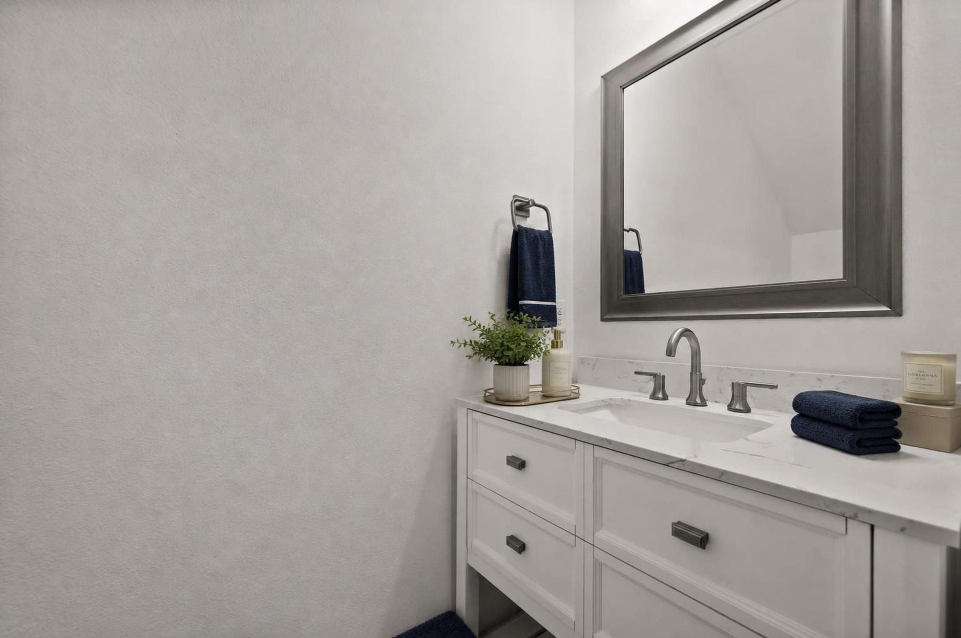 1128 Malone Street, Houston, TX 77007 The first-floor powder bath adds convenience near the main living spaces. Its clean vanity and updated finishes keep the downstairs layout polished and complete.