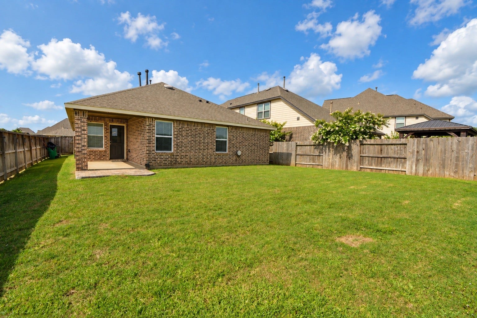 26322 Stonedale View Drive, Richmond, TX 77406 Spacious backyard with a covered porch, perfect for entertaining
