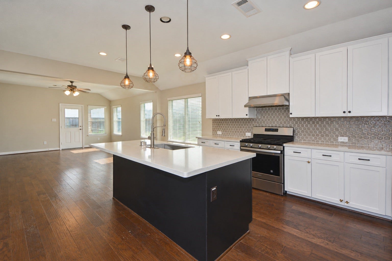 26322 Stonedale View Drive, Richmond, TX 77406 Kitchen view highlighting the open-concept layout connecting to the living and dining areas