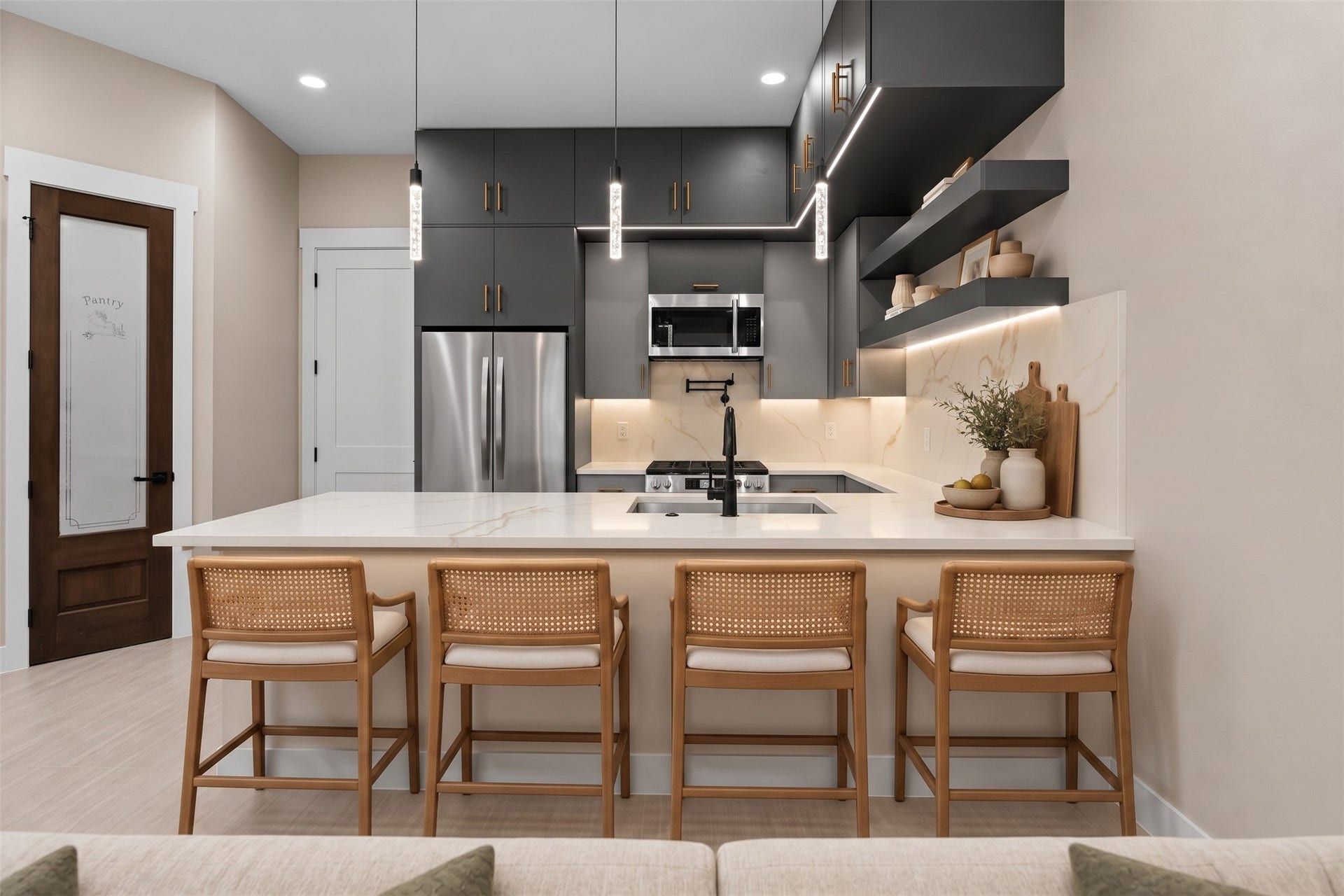 Virtually Staged: Designed for both daily living and hosting, this open kitchen features double-stacked upper cabinets for optimized storage space alongside a large functional island.