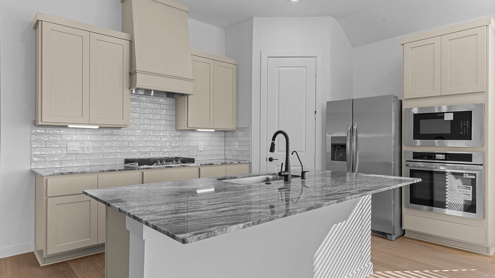 14028 Pine Cliffs Drive, Texas City, TX 77568 Kitchen adorned with painted cabinets seamlessly integrated into an open dining area layout.