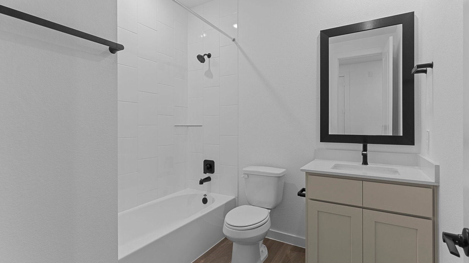 14028 Pine Cliffs Drive, Texas City, TX 77568 A well-designed bathroom equipped with quartz countertops, a standing tub, and a single vanity