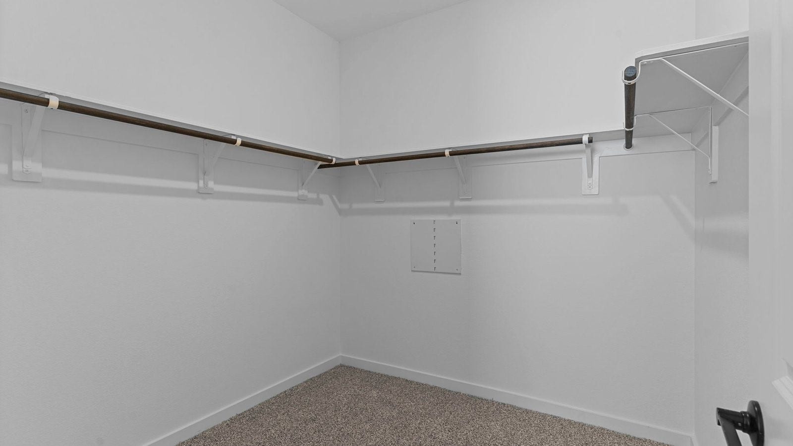 14028 Pine Cliffs Drive, Texas City, TX 77568 A spacious walk-in closet off the primary bathroom with multiple hanging rods, and shelves for maximum storage capabilities.