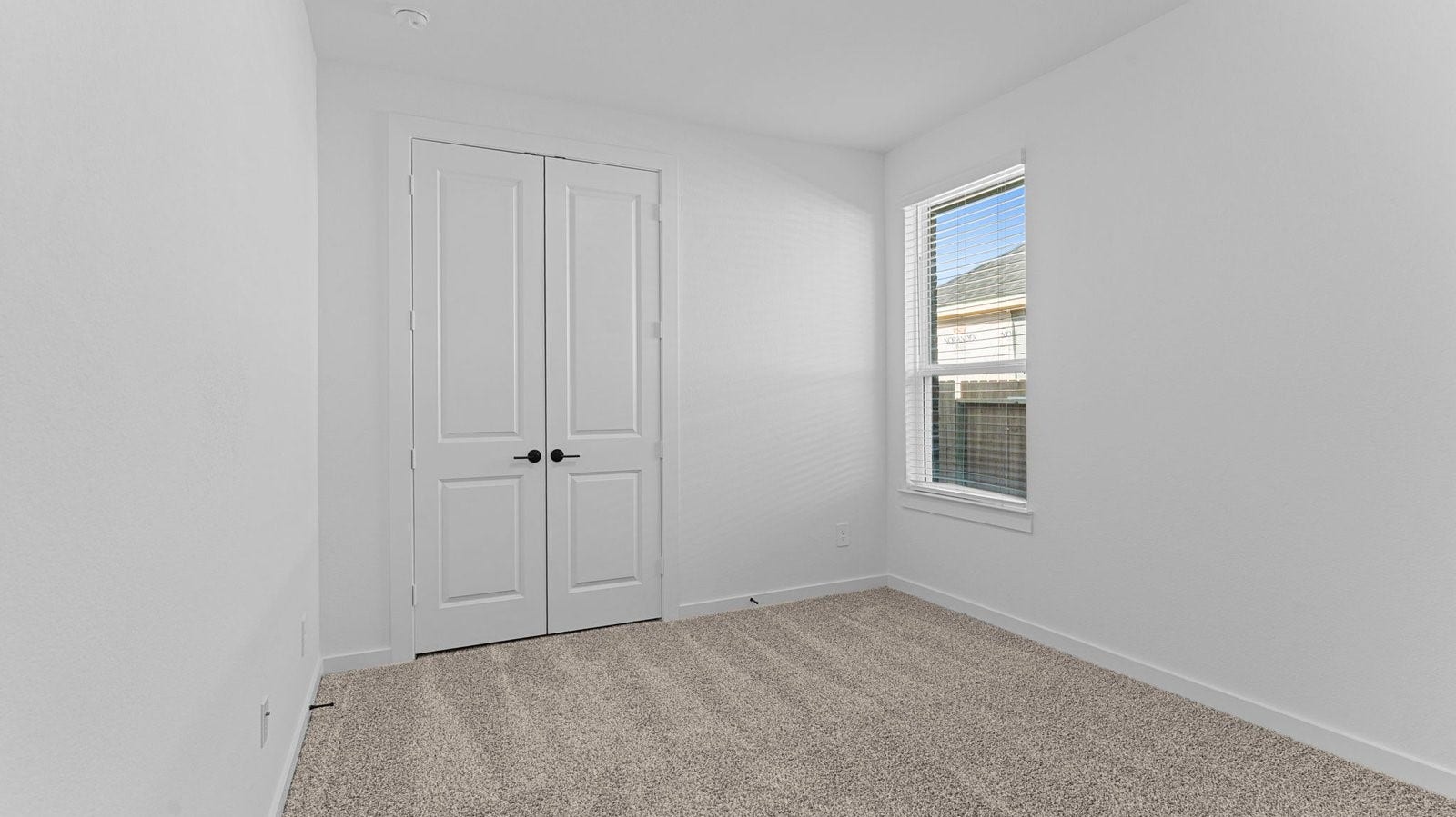 14028 Pine Cliffs Drive, Texas City, TX 77568 A third bedroom with neutral walls, plush carpet flooring and a separate closet