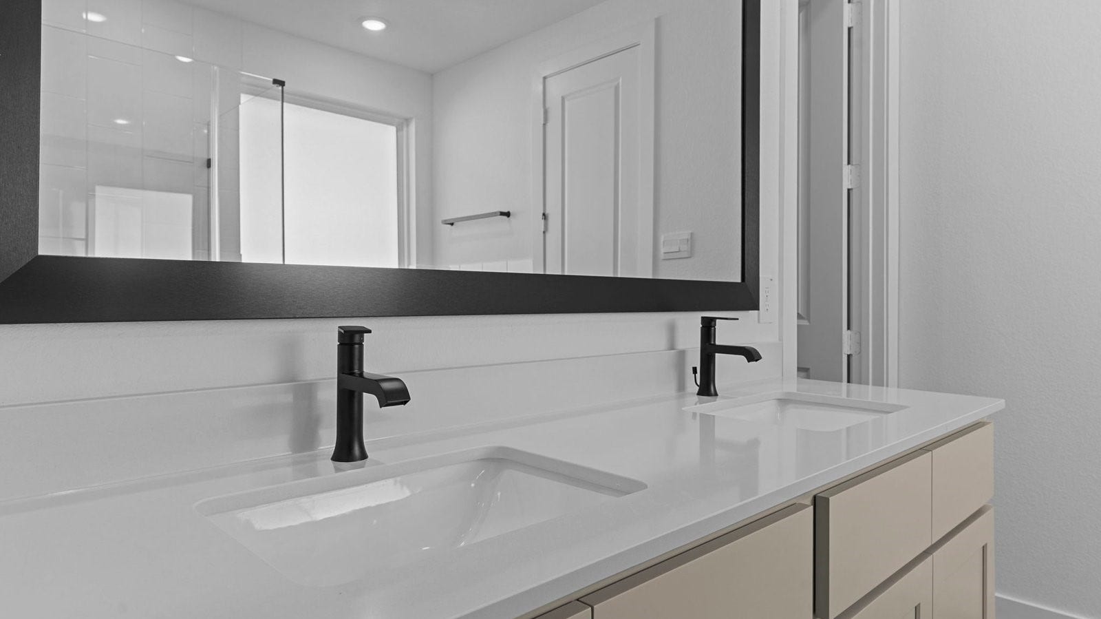 14028 Pine Cliffs Drive, Texas City, TX 77568 primary bathroom with double vanities, quartz countertops, and a glass-enclosed shower with a walk-in closet.