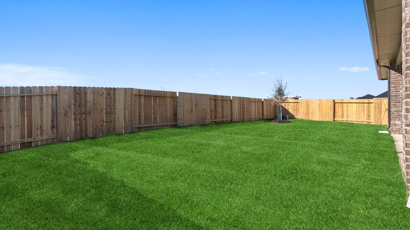 14028 Pine Cliffs Drive, Texas City, TX 77568 Large fenced-in backyard with a covered patio, perfect for outdoor entertaining.