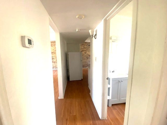 215 Avenue E, South Houston, TX 77587 Hallway from bedrooms to hall bath, kitchen, and living room.