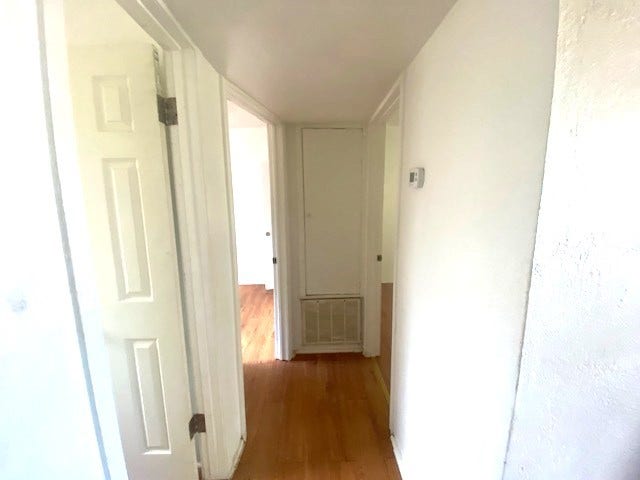 215 Avenue E, South Houston, TX 77587 Laminate flooring throughout hallway to bedrooms.
