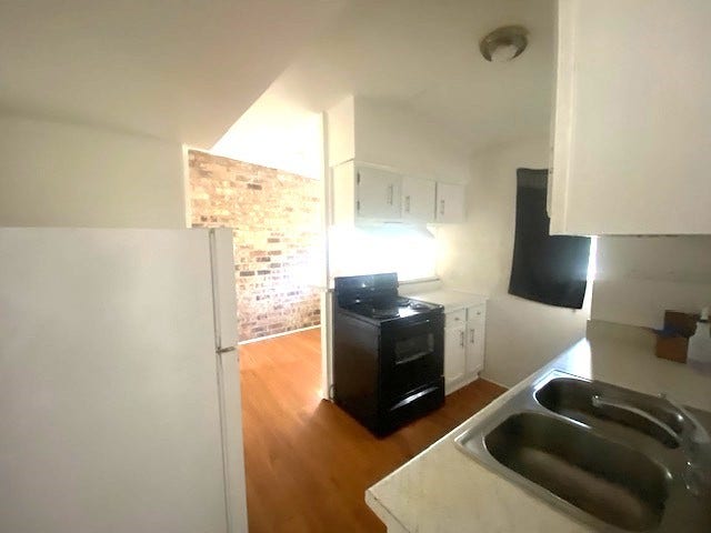 215 Avenue E, South Houston, TX 77587 Kitchen with refrigerator included.
