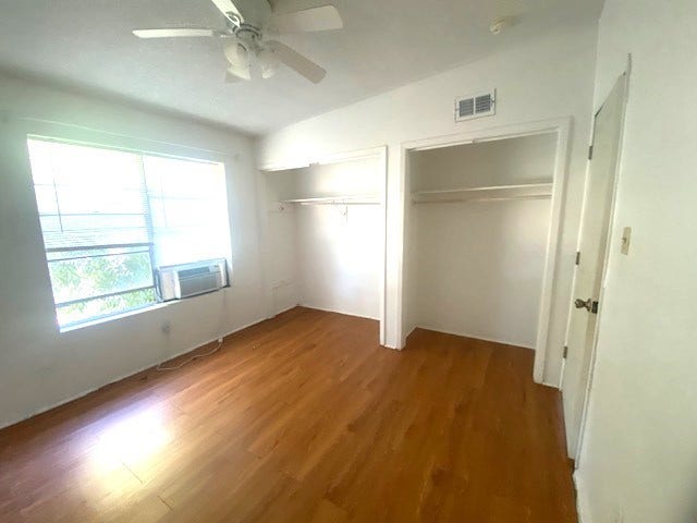 215 Avenue E, South Houston, TX 77587 Primary bedroom is spacious with ac window unit and extra closet space.