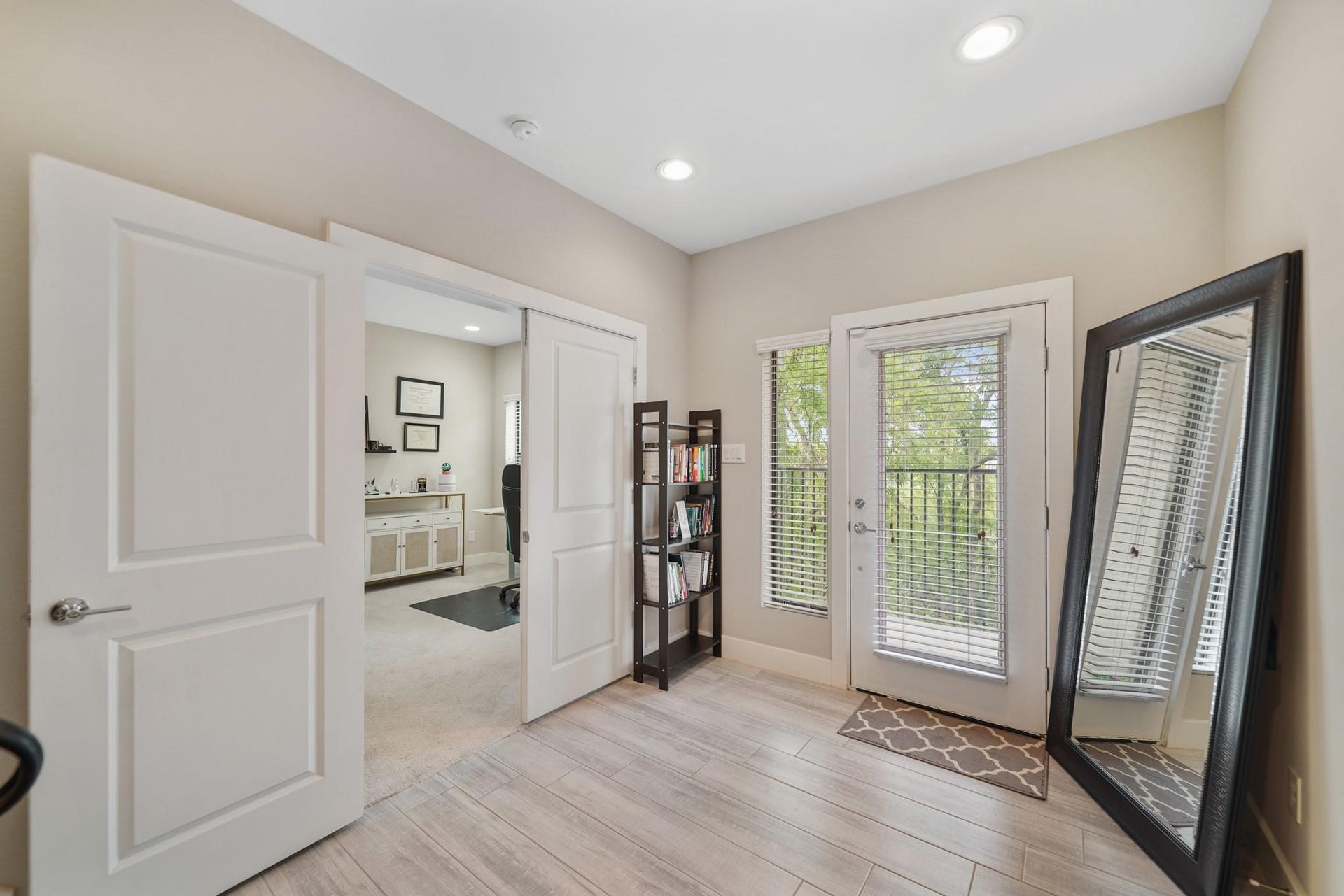 1824 Bonner Street, Houston, TX 77007 Included is a glass front door with window & blinds. A first floor bedroom with ensuite bath is accessible just through the double door entry on the left.