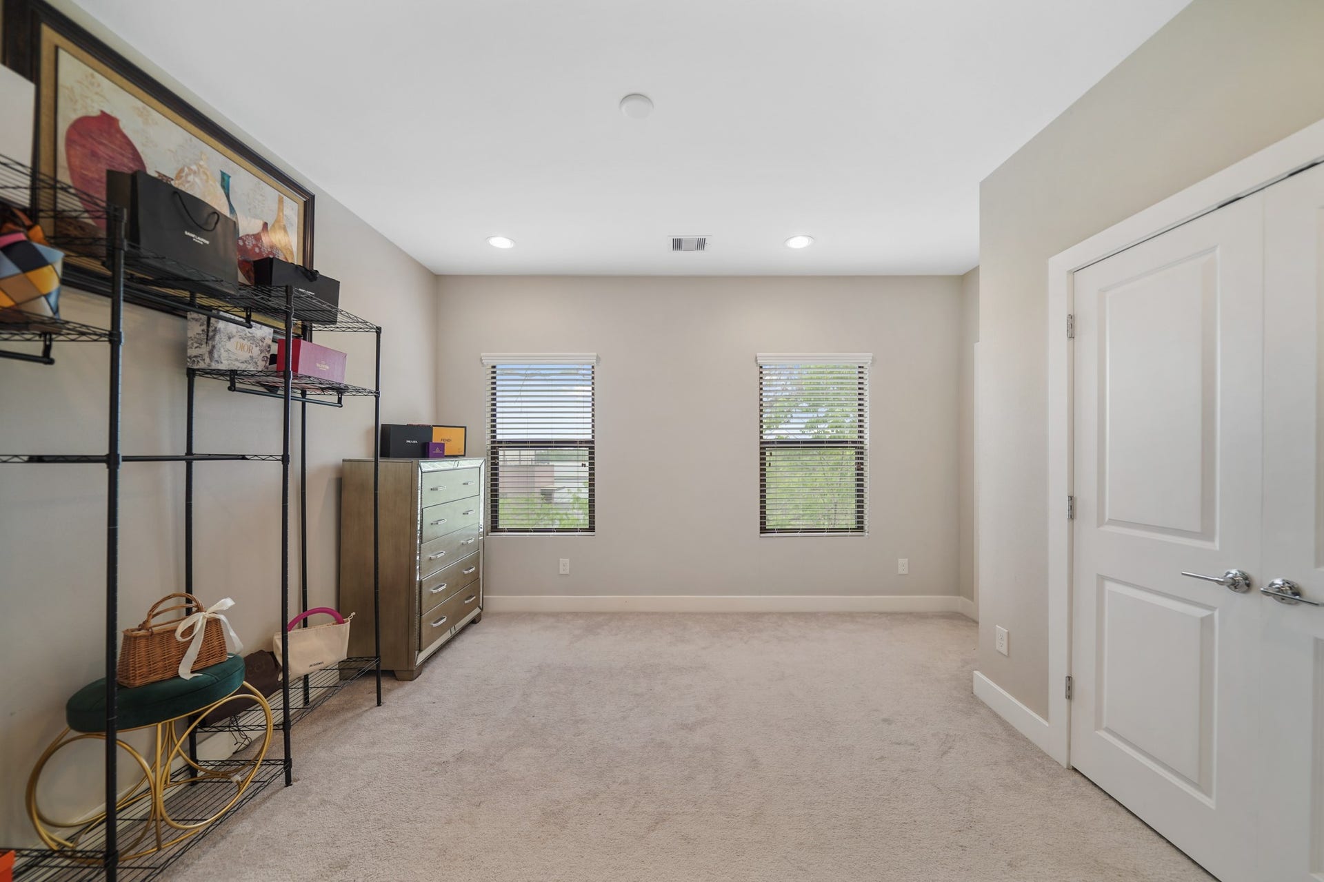 1824 Bonner Street, Houston, TX 77007 Included are two windows with blinds overlooking the side of the home along with a double door wardrobe storage closet.