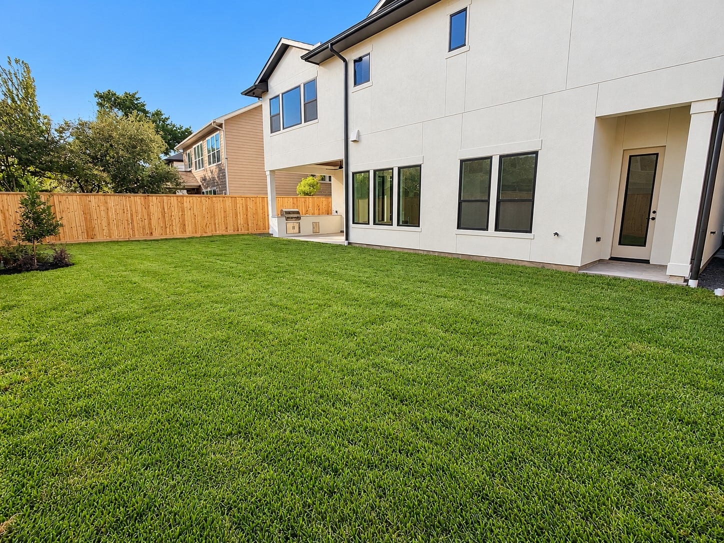 1225 Wakefield Drive, Houston, TX 77018 The backyard has plenty of room for a pool. The small porch to the right is to the pool bath, and the outdoor living with Summer kitchen is on the left end of the home.