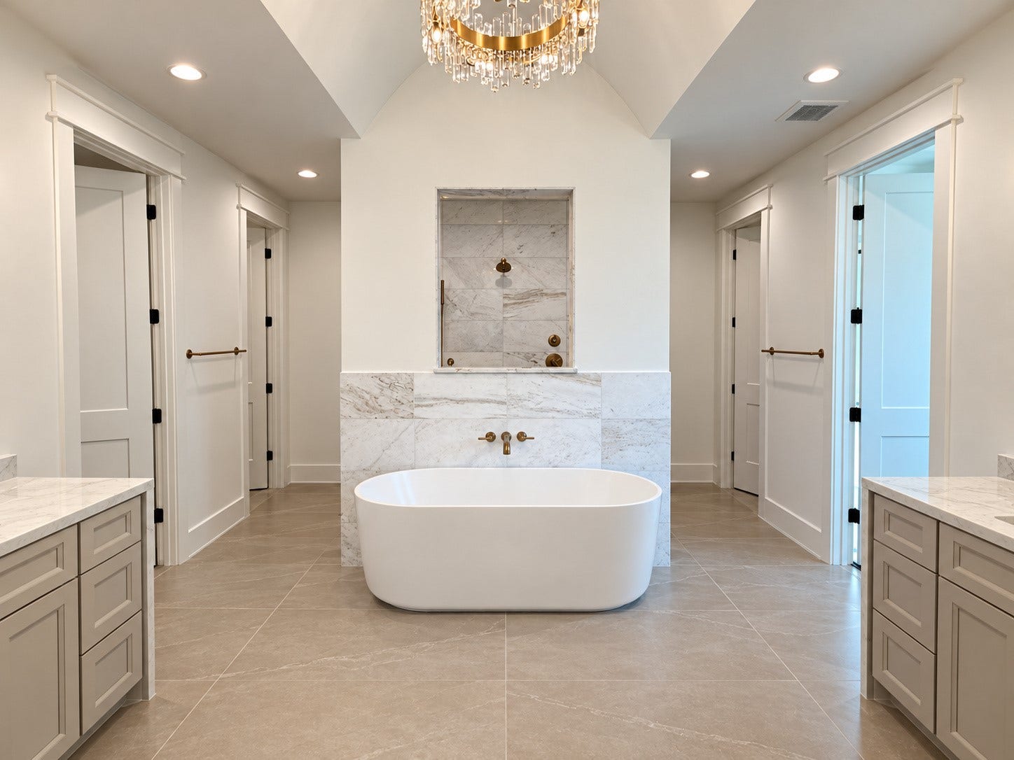 1225 Wakefield Drive, Houston, TX 77018 This gorgeous symmetrical bathroom features his and her vanities, closets, and water closets. The fluted freestanding tub makes a statement in front of the dual-entry shower.