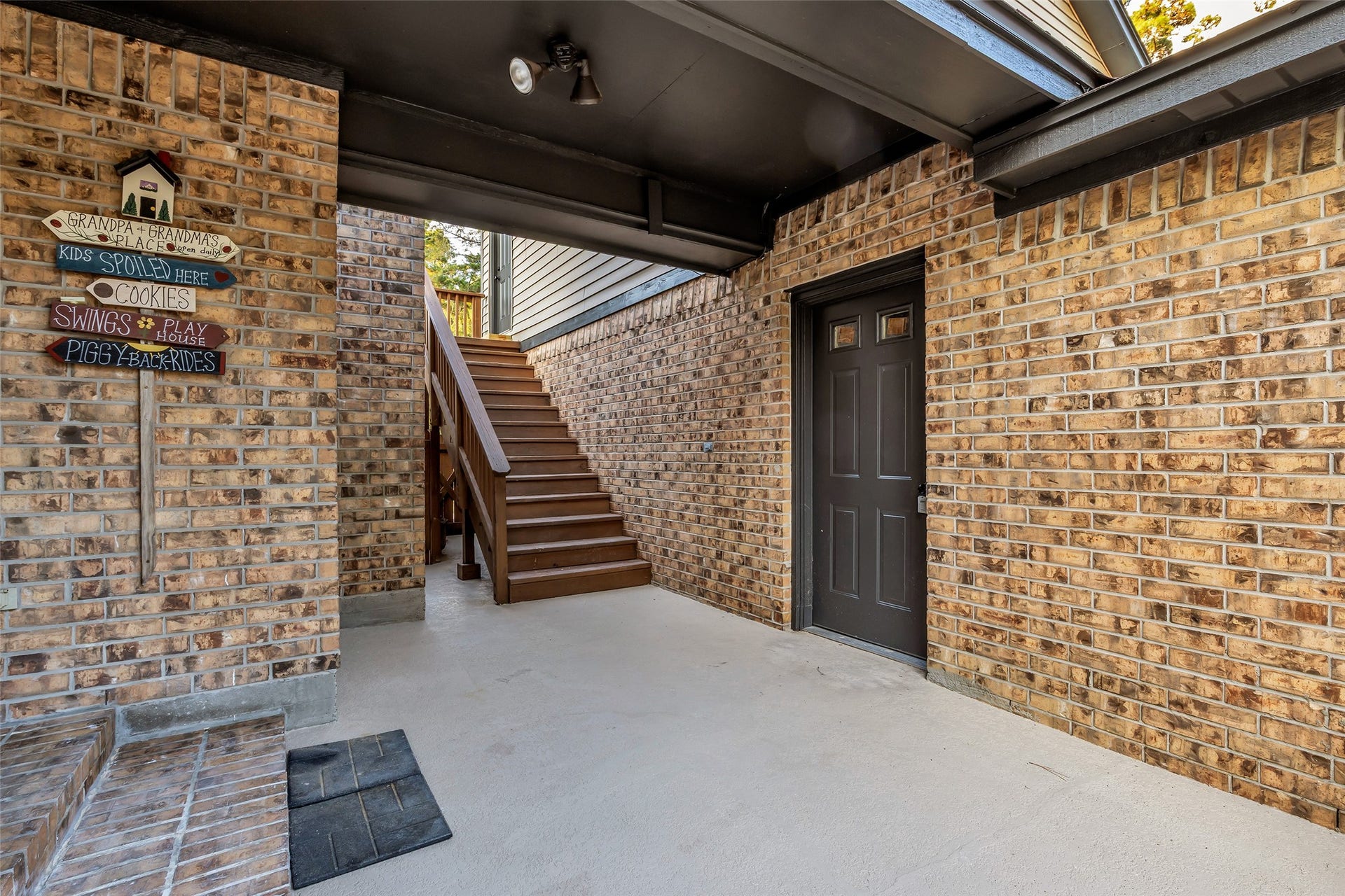 Enclosed Breezeway from oversized garage to home with stair leading to the bonus room
