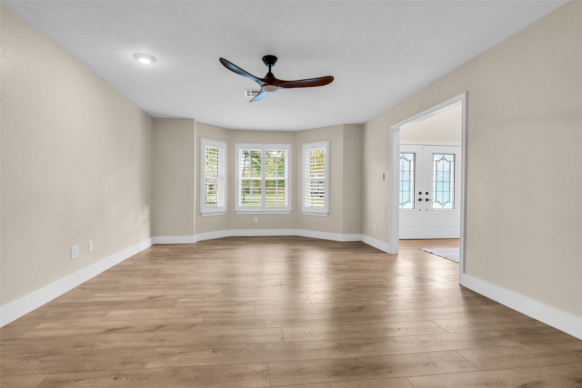 View of Living area from the kitchen- Imagine your Christmas Tree in front of these windows!