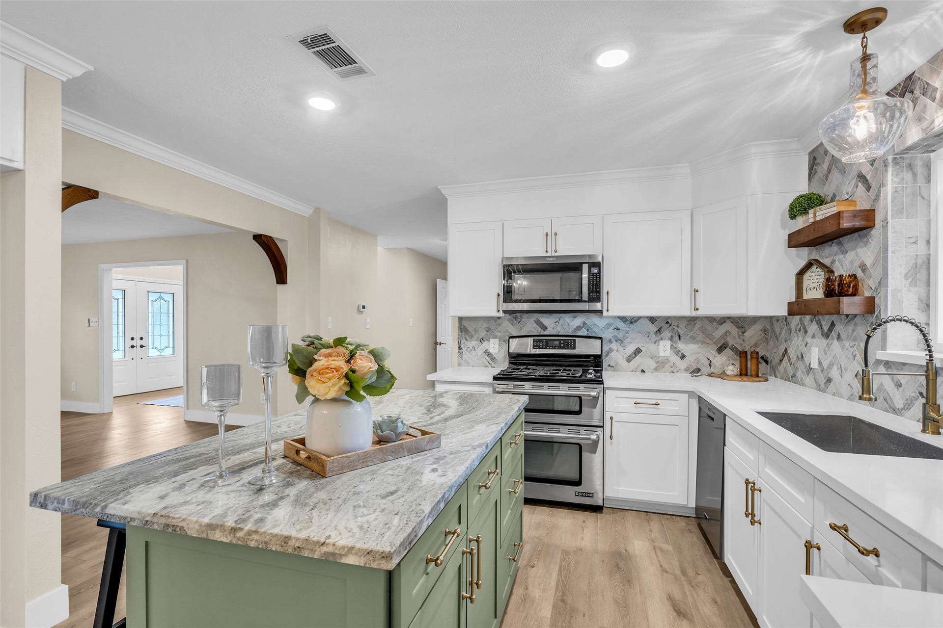 Fantasy Brown island countertop on the center island with plenty of storage