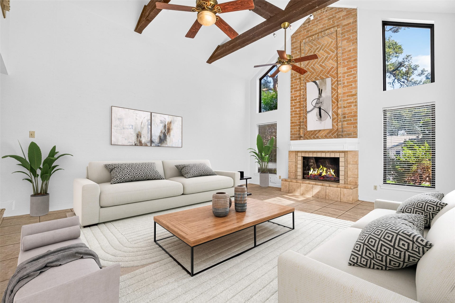 3119 Villa Lane, Missouri City, TX 77459 Living room with virtual staging. This room is expansive, accented by a beamed ceiling and floor to ceiling fireplace. The space shines with natural light!