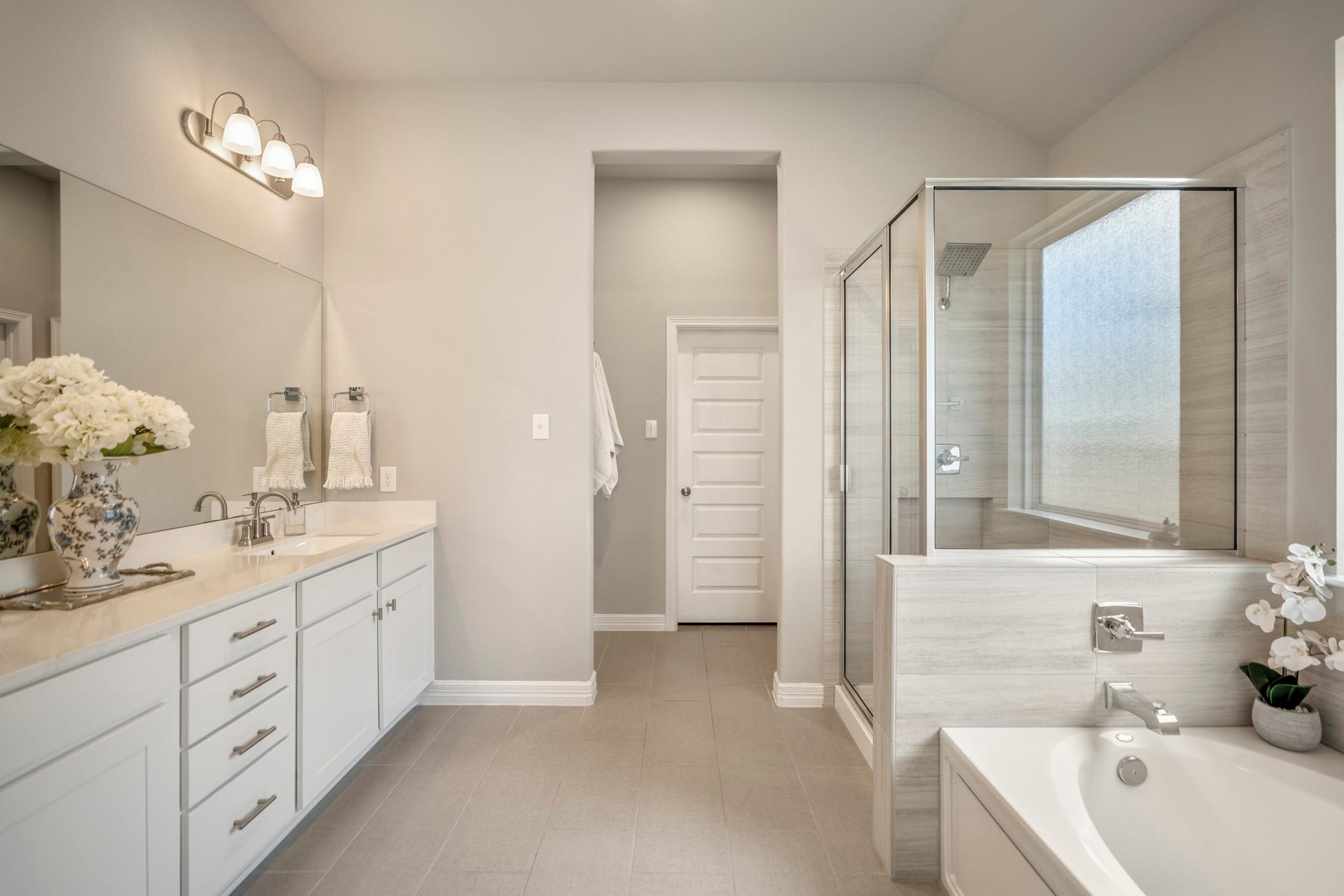 Primary bathroom features separate shower and soaking tub, walk-in closet and water closet.
