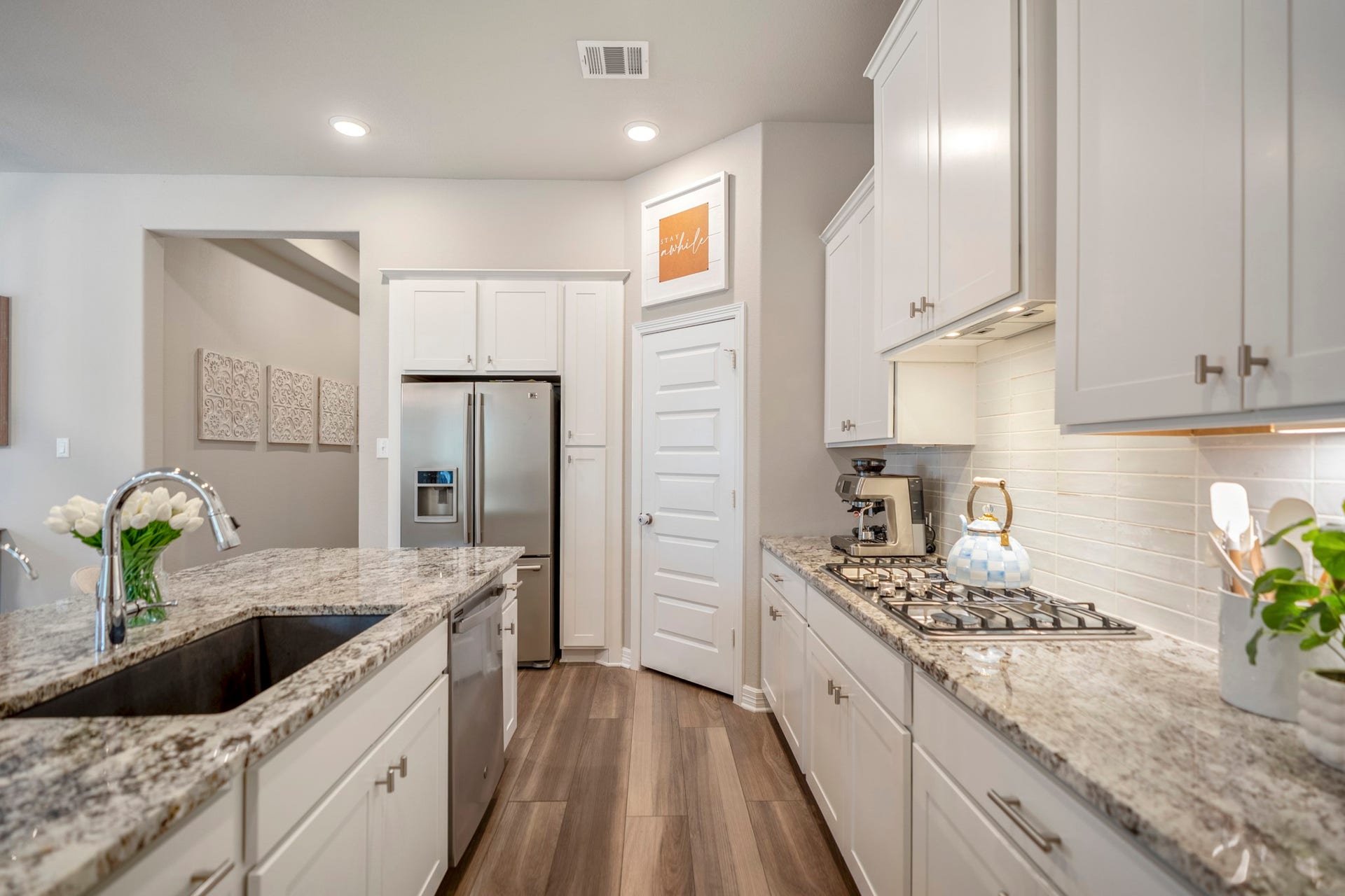 Notice the gas cooktop and Blanco undermount kitchen sink!