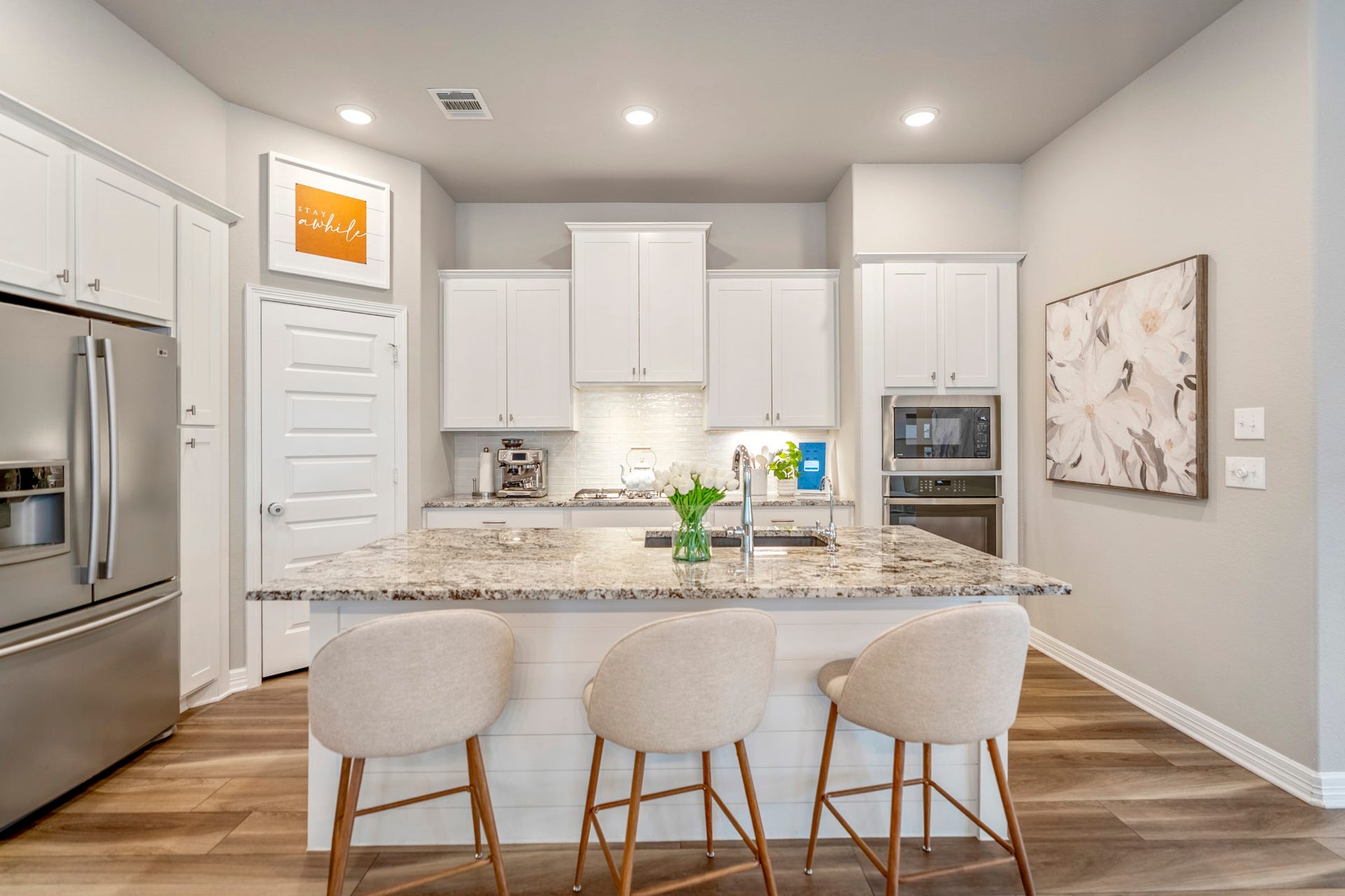 Kitchen features under cabinet lighting and counter seating.