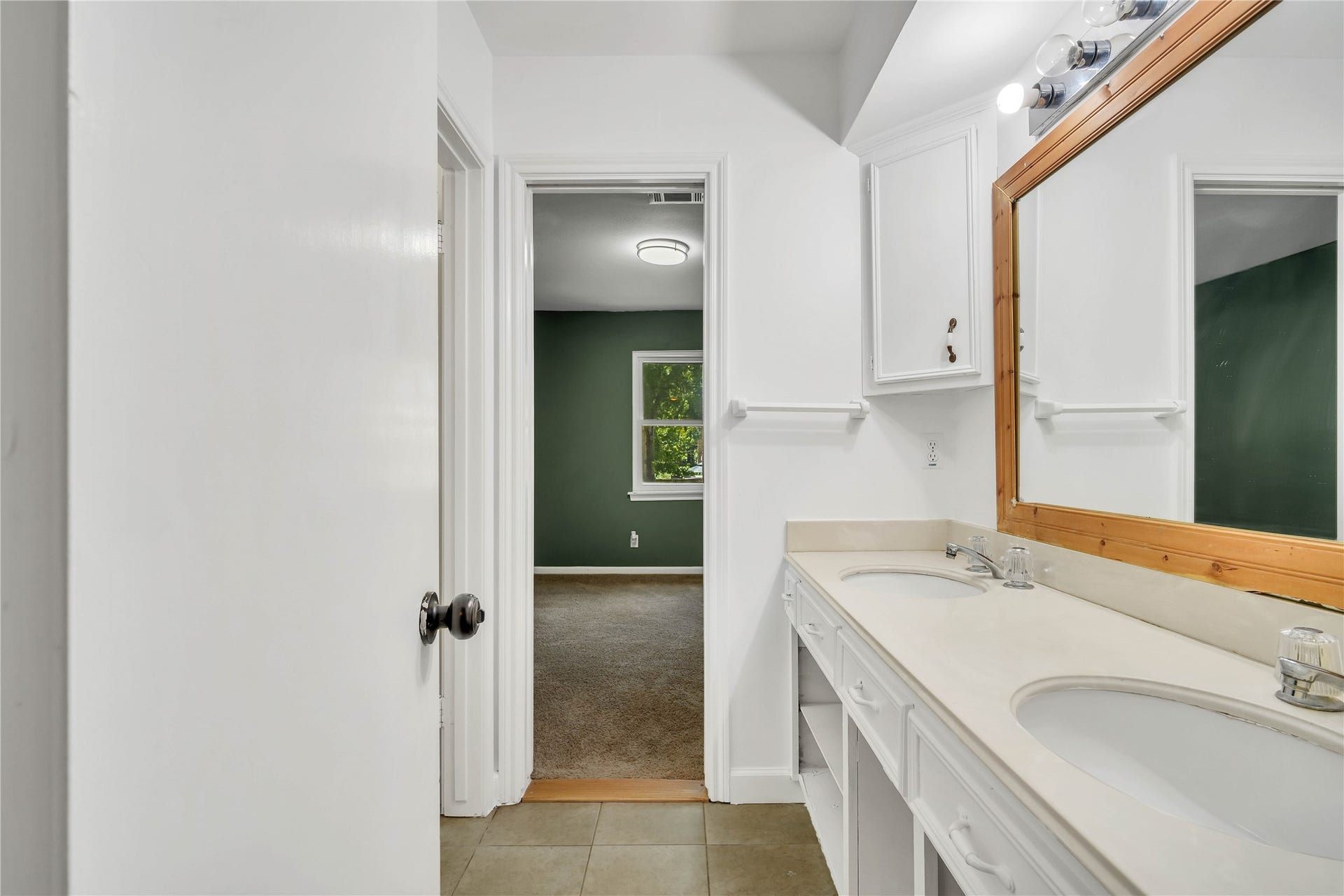 10818 Elmdale Drive, Houston, TX 77070 Additional view of the Jack-and-Jill bathroom highlighting the extended vanity and convenient access between both upstairs bedrooms.