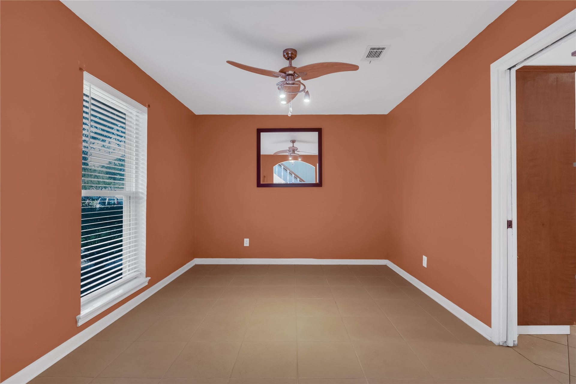 10818 Elmdale Drive, Houston, TX 77070 Generously sized formal dining room offering an elegant setting for intimate dinners and memorable gatherings.