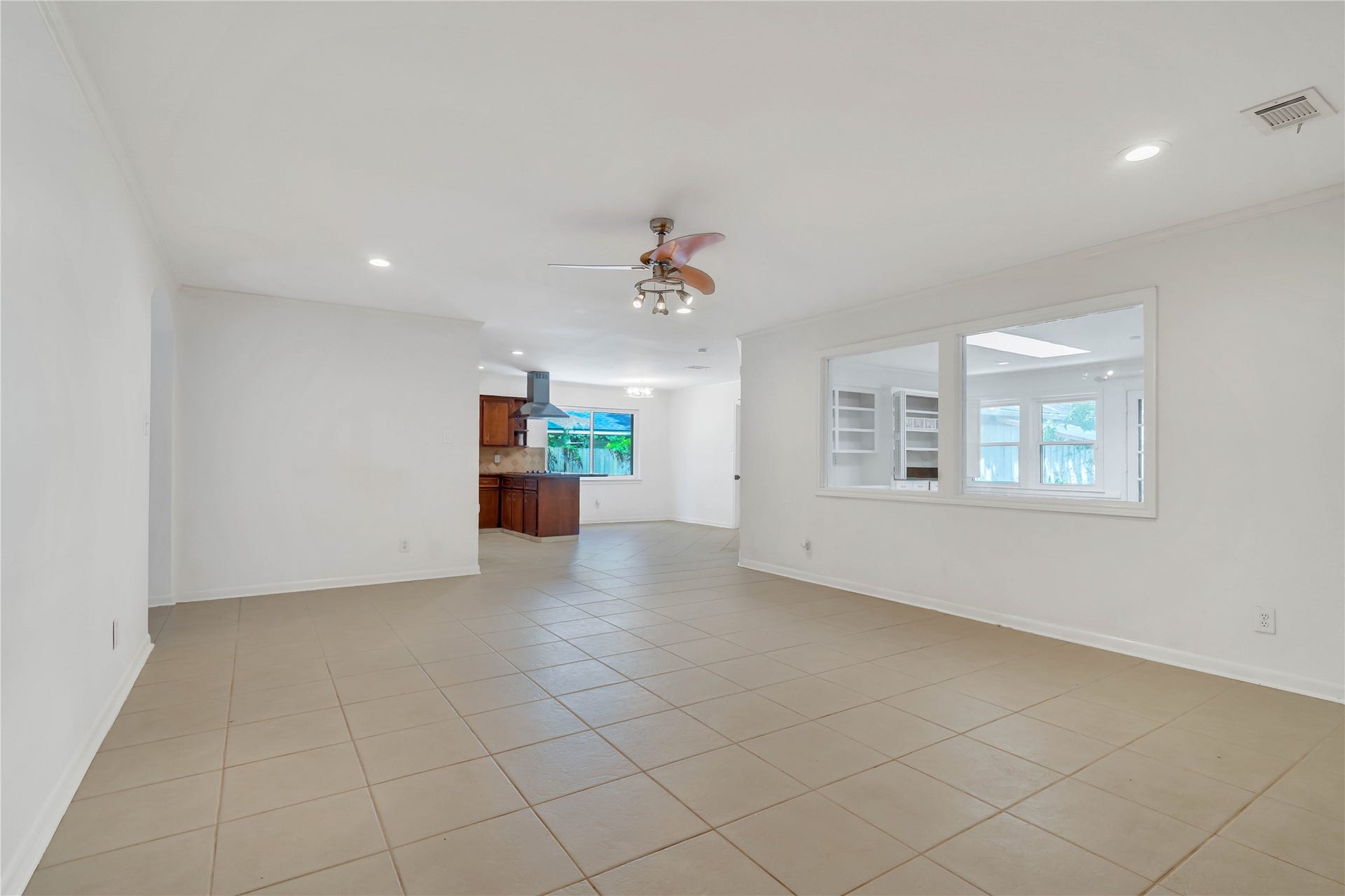 10818 Elmdale Drive, Houston, TX 77070 Open-concept living area offering generous space for multiple seating arrangements, with abundant natural light and seamless flow into the adjoining areas.
