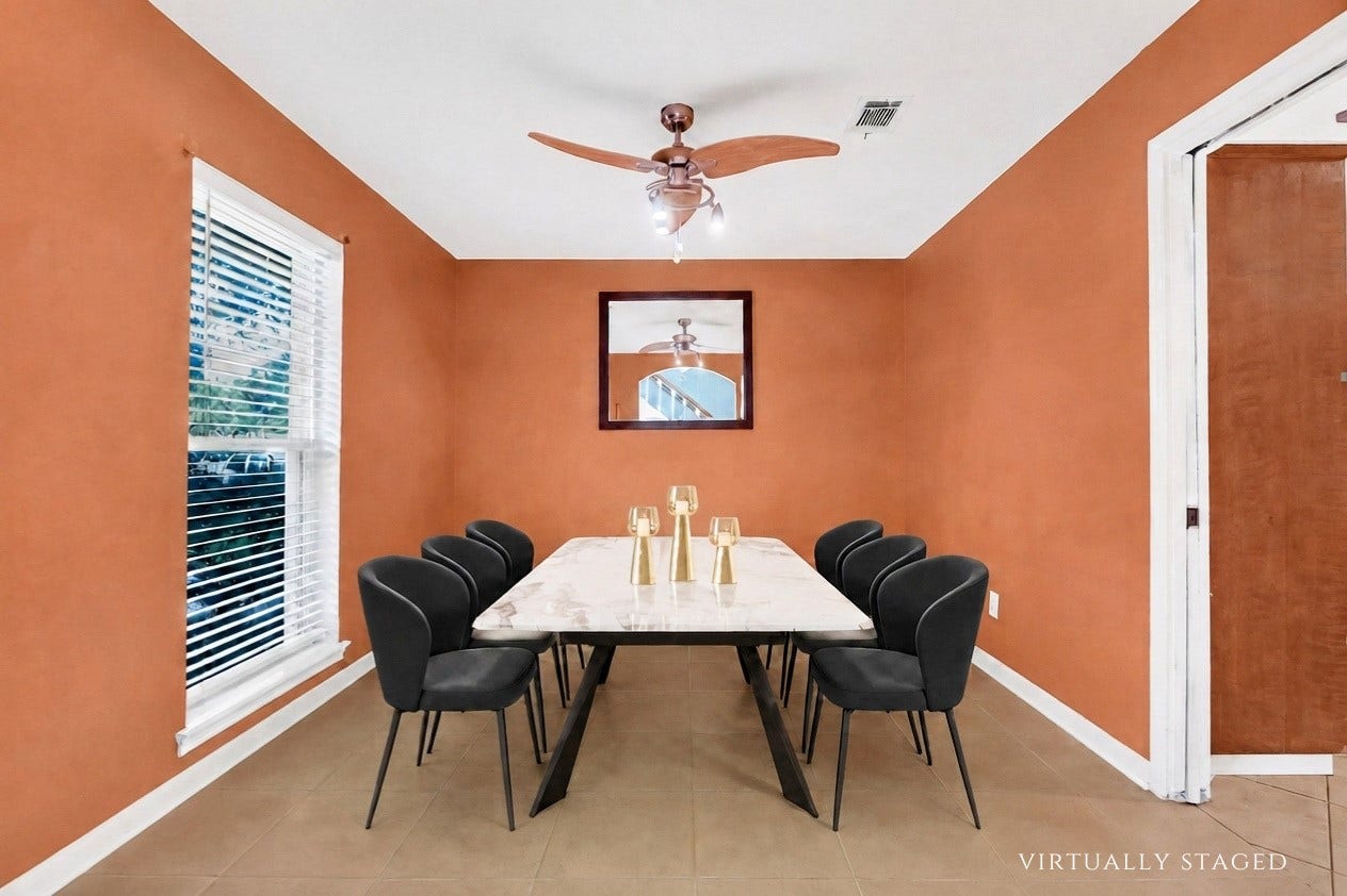 10818 Elmdale Drive, Houston, TX 77070 Virtually staged to showcase the generous scale of the formal dining room, comfortably accommodating a six-seat dining table with ample room for entertaining.