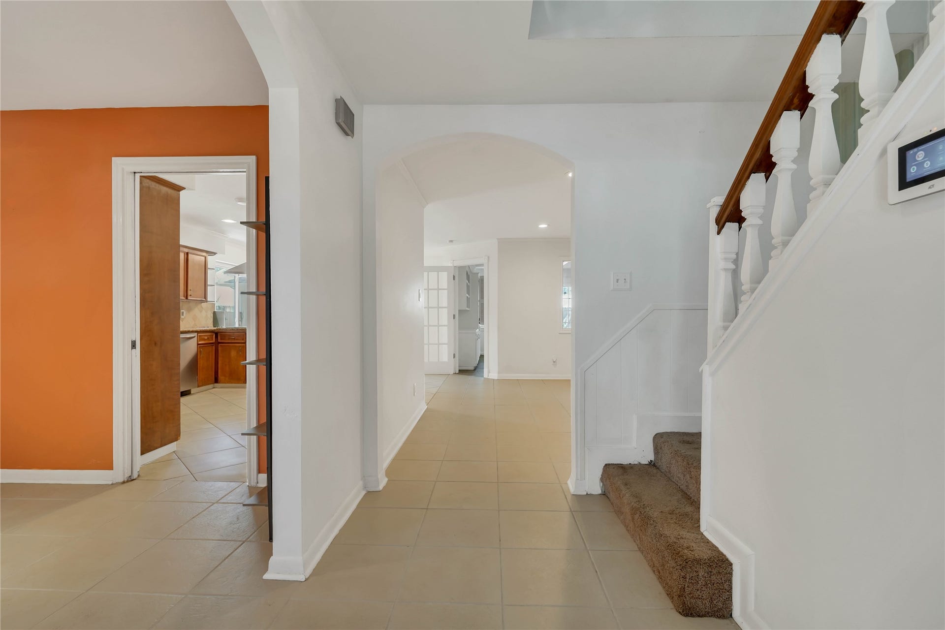 10818 Elmdale Drive, Houston, TX 77070 A gracious entryway introduces the home, with the formal dining room to the left, staircase to the right, and an inviting sightline into the living room beyond.