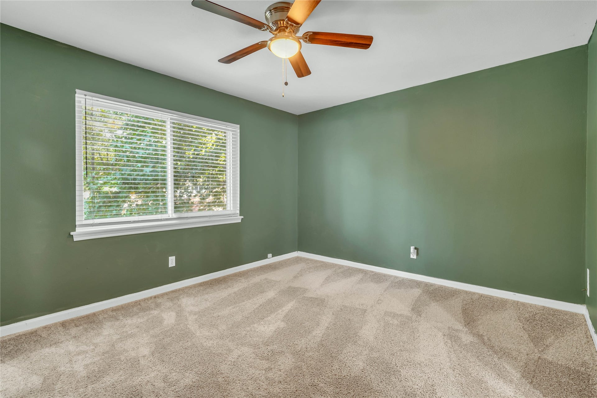 10818 Elmdale Drive, Houston, TX 77070 Spacious upstairs bedroom with abundant natural light and direct access to a Jack-and-Jill bathroom.