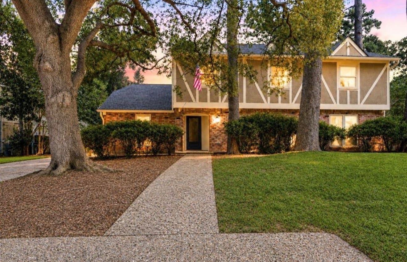 10818 Elmdale Drive, Houston, TX 77070 Inviting front exterior showcasing the homes distinctive two-story architecture, mature trees, and established Norchester setting.