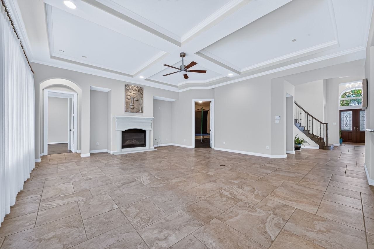 Formal living with fireplace and gorgeous lakeview