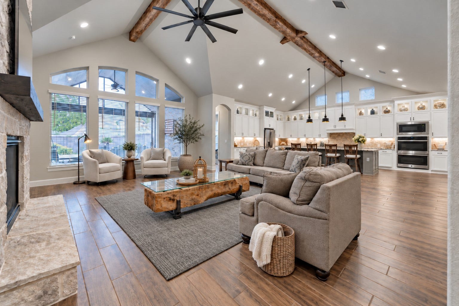 305 Pewter Sky Drive, Montgomery, TX 77316 This room is EVERYTHING! Light, bright & truly impressive w/soaring ceilings, reclaimed wood beams, a dramatic floor-to-ceiling stone fireplace w/hearth & a wall of windows.