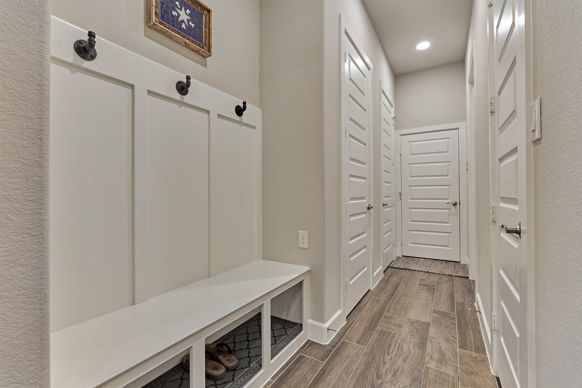 305 Pewter Sky Drive, Montgomery, TX 77316 A thoughtfully designed mudroom/drop zone adds everyday function w/a built-in bench, wall hooks and convenient storageperfectly positioned to keep bags, shoes and daily essentials organized and out of sight.