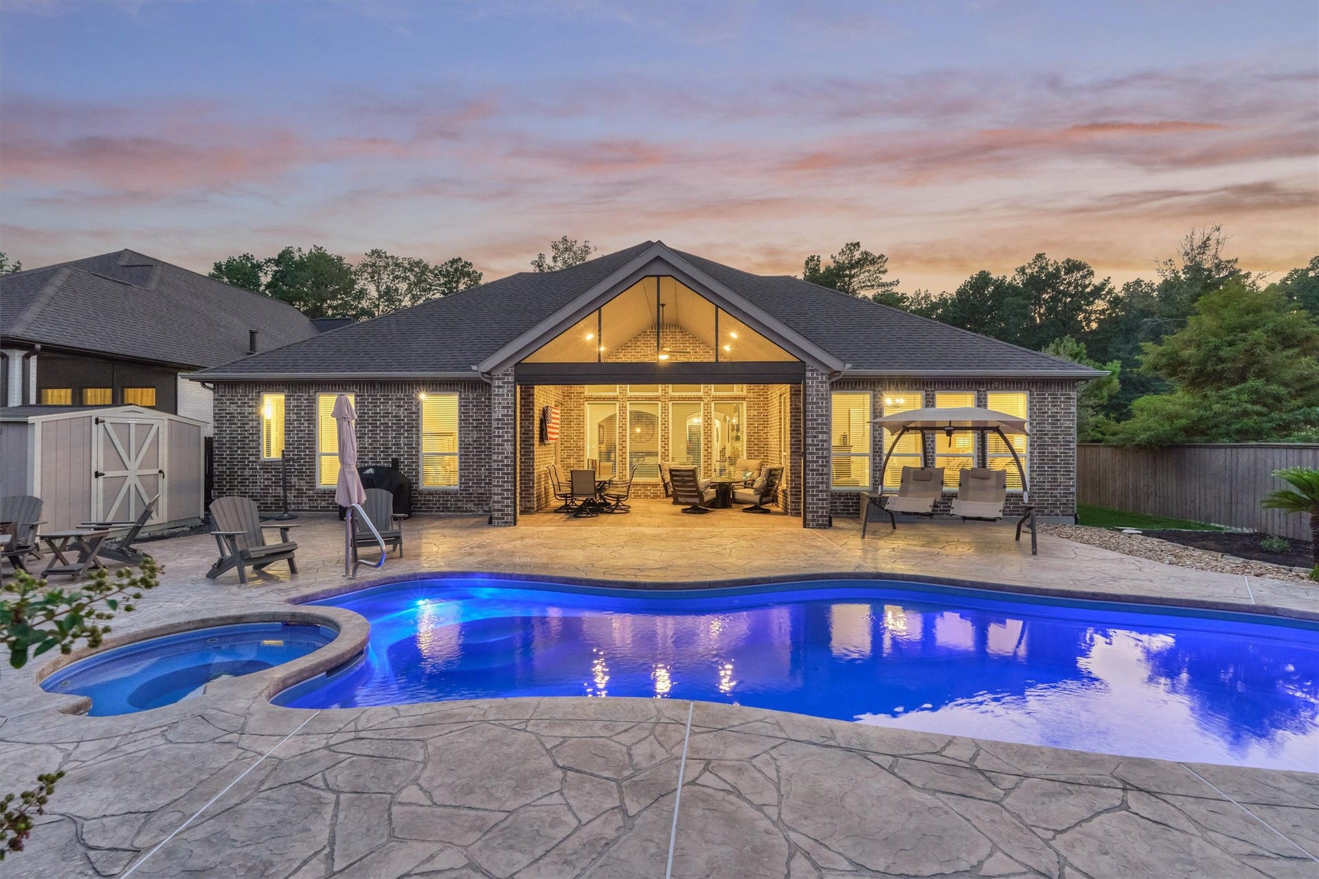 305 Pewter Sky Drive, Montgomery, TX 77316 Enjoy exceptional outdoor living with a private pool and spa, generous stamped-concrete decking, and a spacious screened patio that seamlessly extends the homes entertaining space.