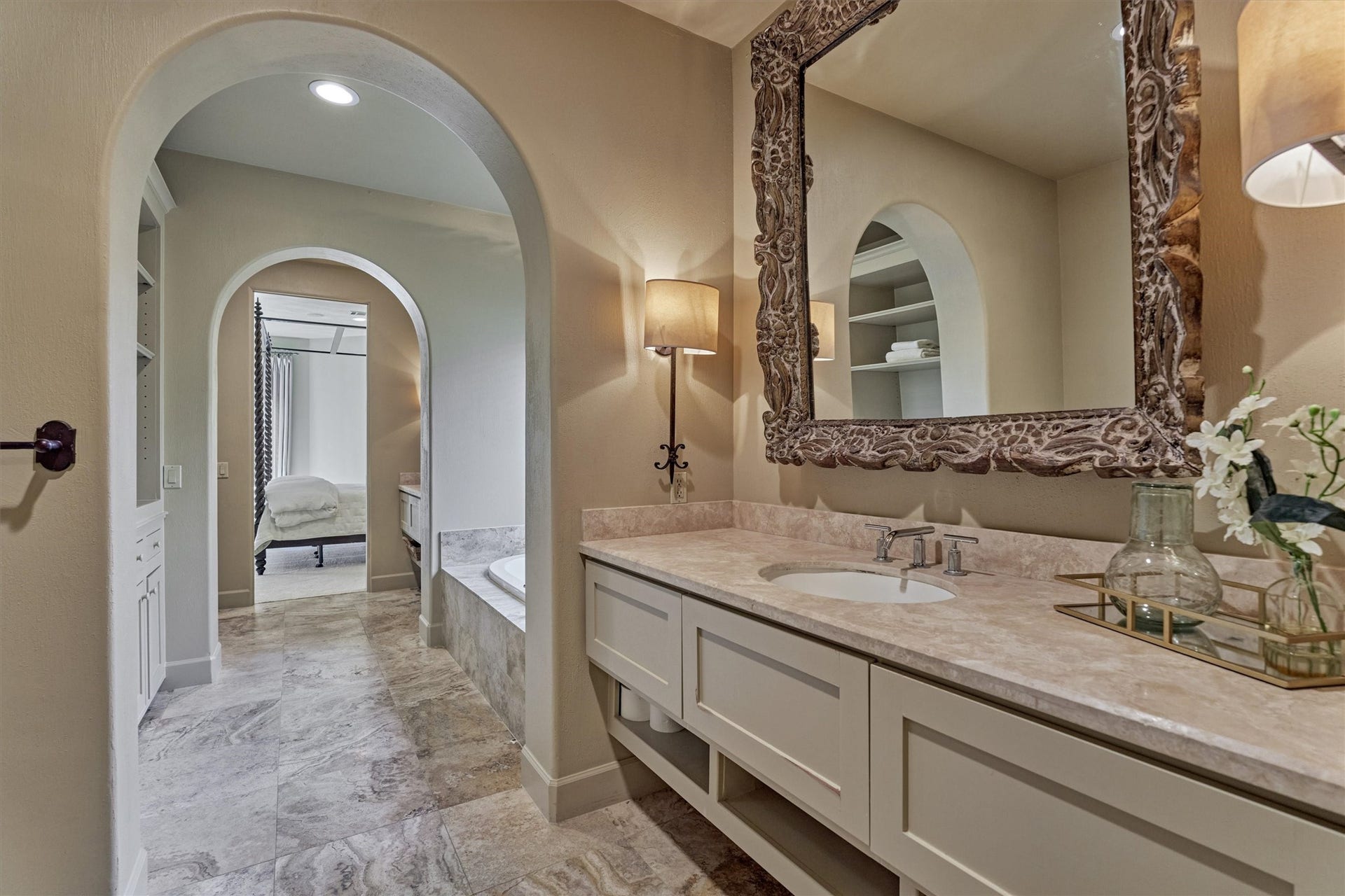 7 Dorset Square, The Woodlands, TX 77381 Primary bath features open shelving and storage cabinets near soaking tub.