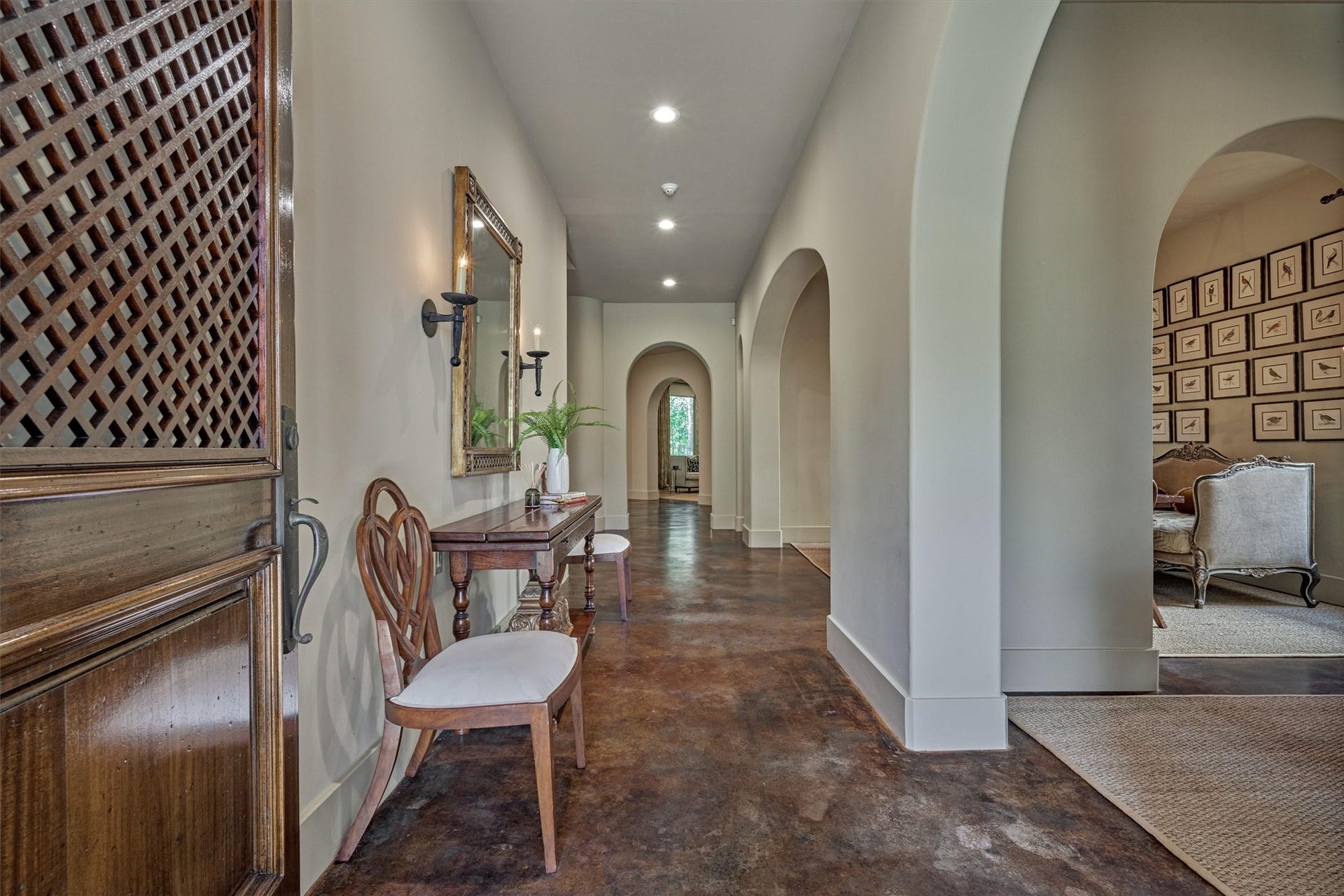 7 Dorset Square, The Woodlands, TX 77381 Elegant entry with stained concrete floors and trimless doorframes.