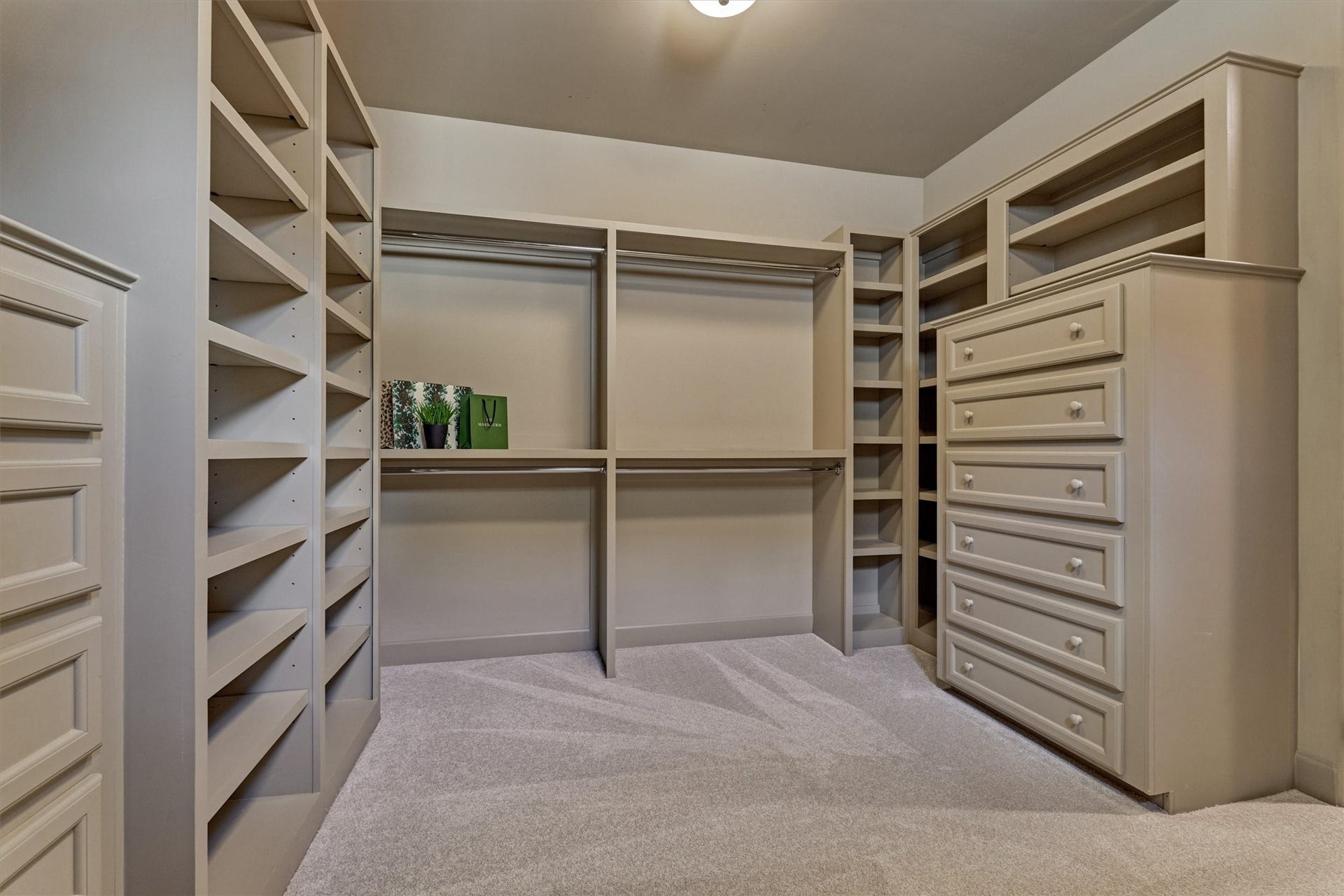 7 Dorset Square, The Woodlands, TX 77381 View 2, large custom walk-in closet with built-in dressers and shelving. 2026 Carpet.