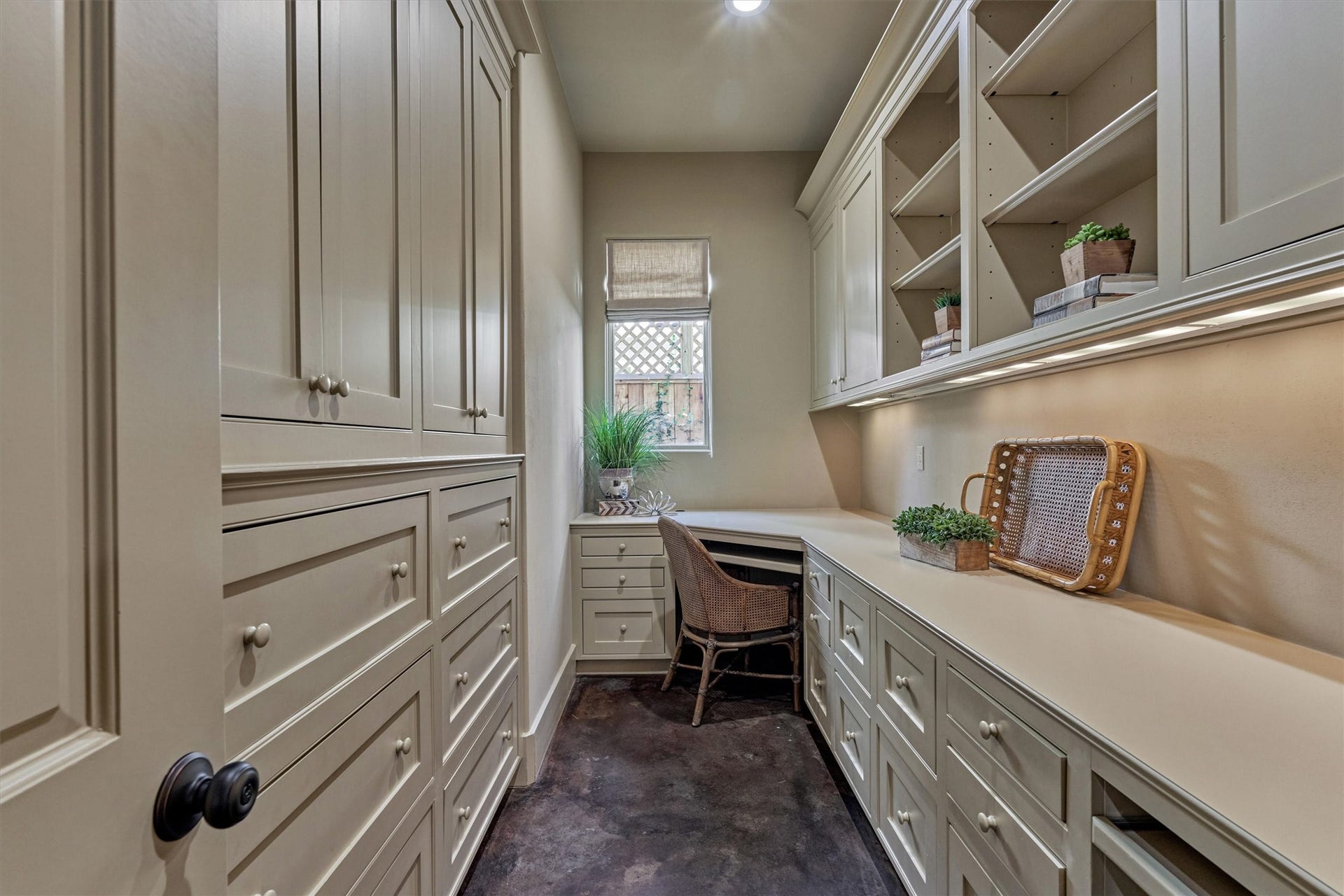 7 Dorset Square, The Woodlands, TX 77381 Versatile prep pantry or home office with abundant storage, including file drawers, two workstations, open shelving and keyed entry access.