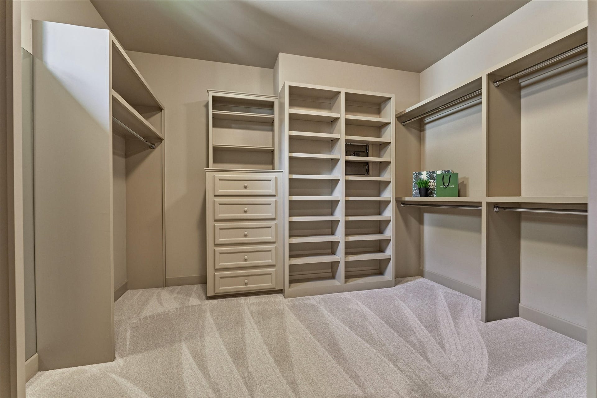 7 Dorset Square, The Woodlands, TX 77381 View 1, large custom walk-in closet with built-in dresser and shelving. 2026 Carpet.