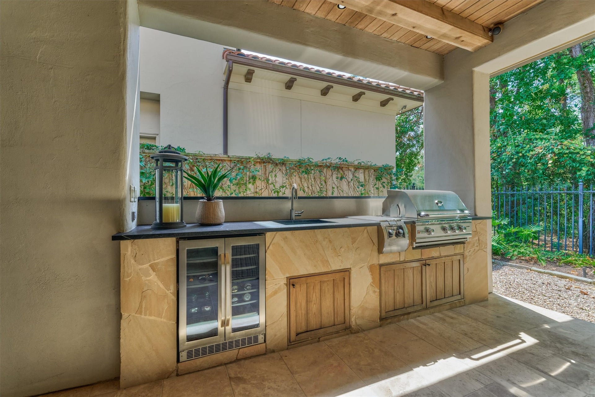 7 Dorset Square, The Woodlands, TX 77381 Covered loggia with outdoor kitchen - sink, prep space, 2026 RCS grill and Silhouette Select refrigerator.